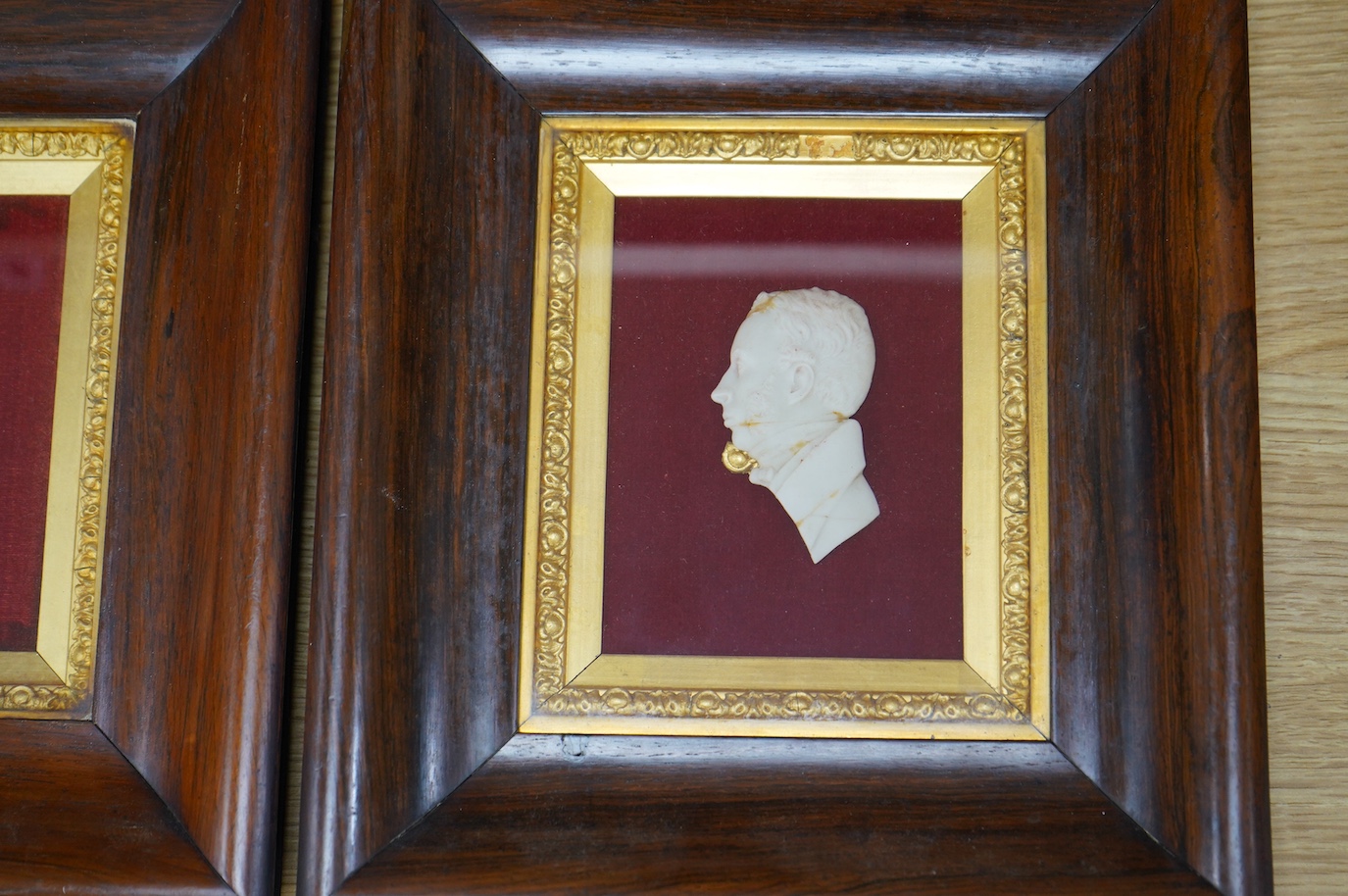 A pair of Victorian rosewood framed wax portraits of Dr. John Dick, 9cm wide, 12cm high. Condition - good